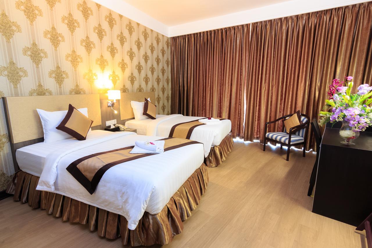 Paradise Hotel Phnom Penh Habitación foto